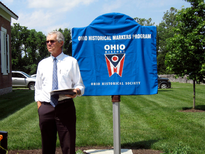 The Ohio Historical Marker is covered prior to unveiling.